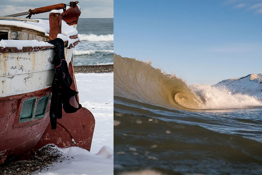 A black wetsuit hung on a wrecked boat in the snow alongside a barrelling wave