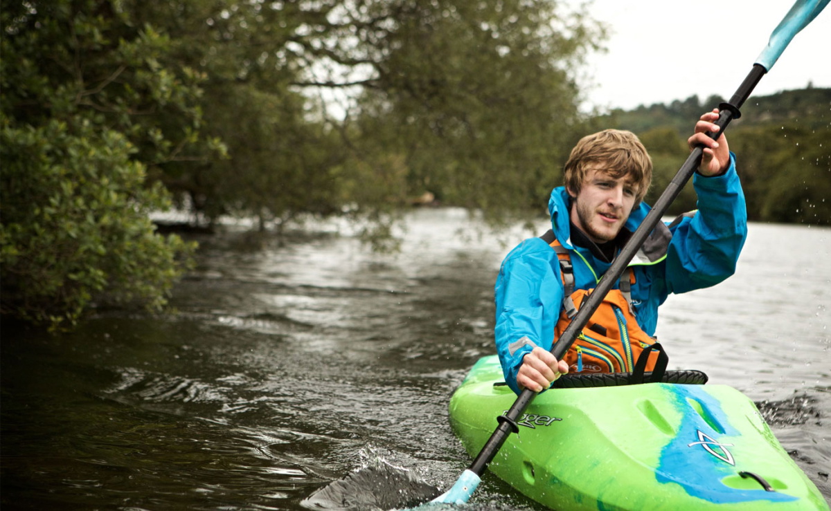 Boy kayaking in Yak summer kit