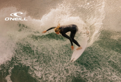 Man wearing an O'Neill wetsuit in the sea